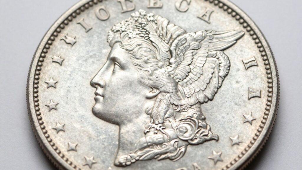 Morgan silver dollar coin with Lady Liberty and eagle.