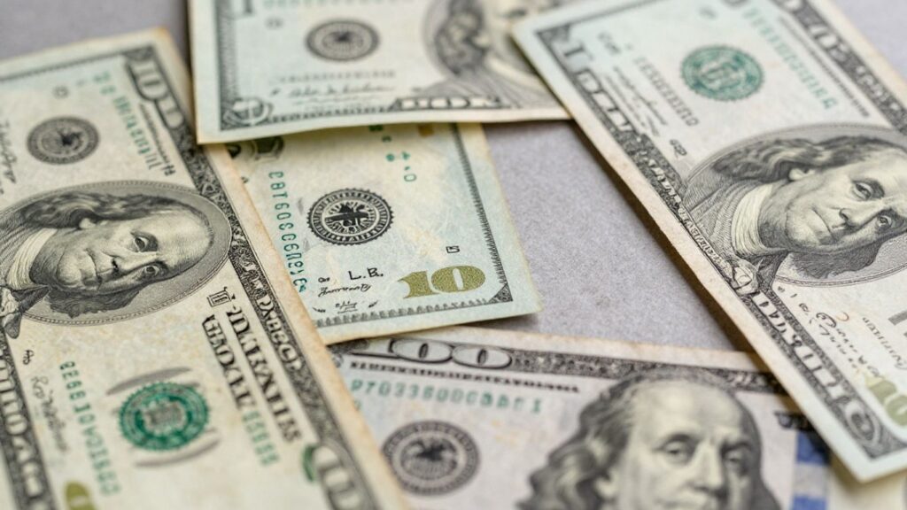 US dollar bills, some worn, for sale in San Antonio.