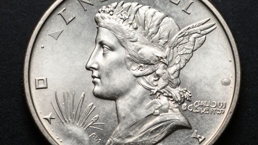 Close-up of a silver Peace Dollar coin.